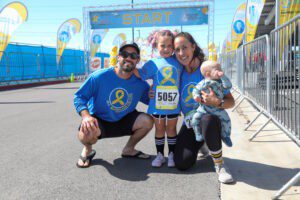 family smiling at marathon